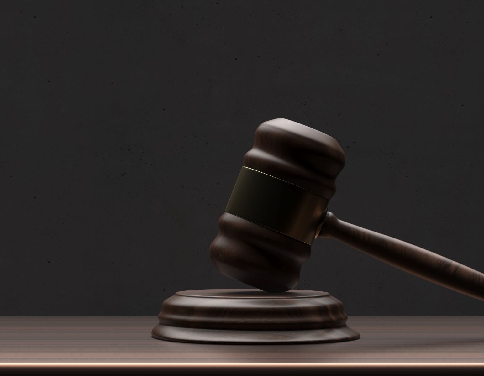 Gavel rests on judge’s bench during larceny trial in Grand Rapids