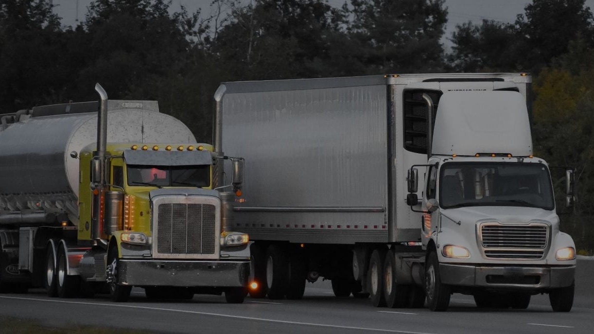 Two 18-wheelers travel down Michigan highway