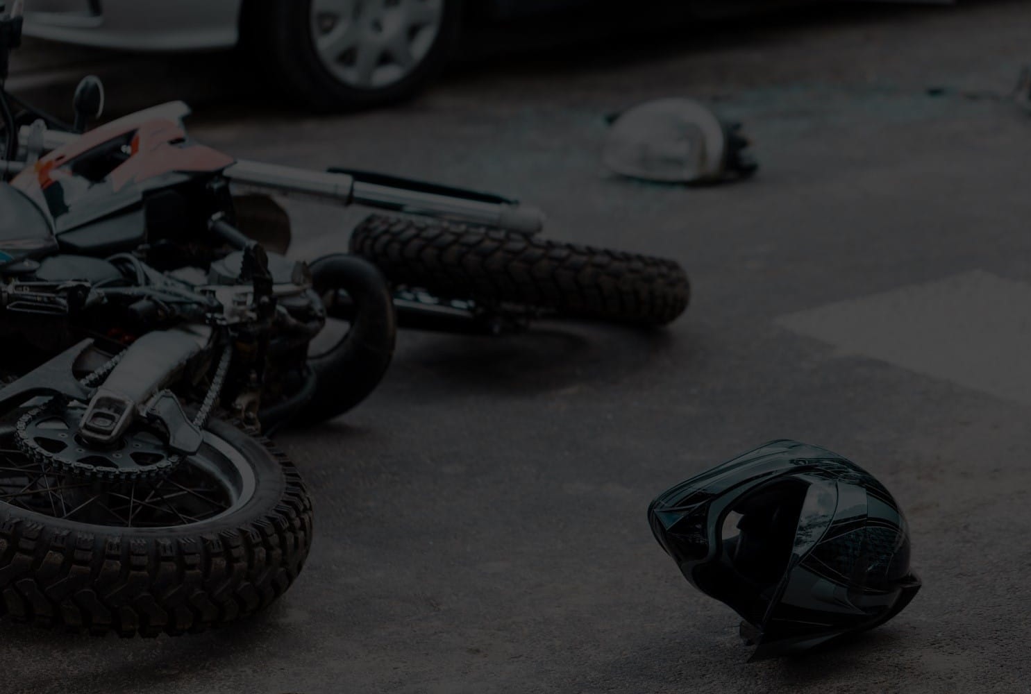 Motorcycle and helmet lay on ground after accident in Grand Rapids