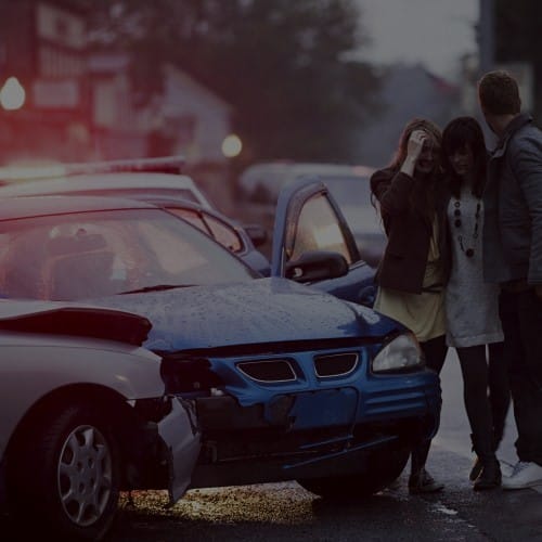 passengers stand outside vehicle after Grand Rapids rideshare accident