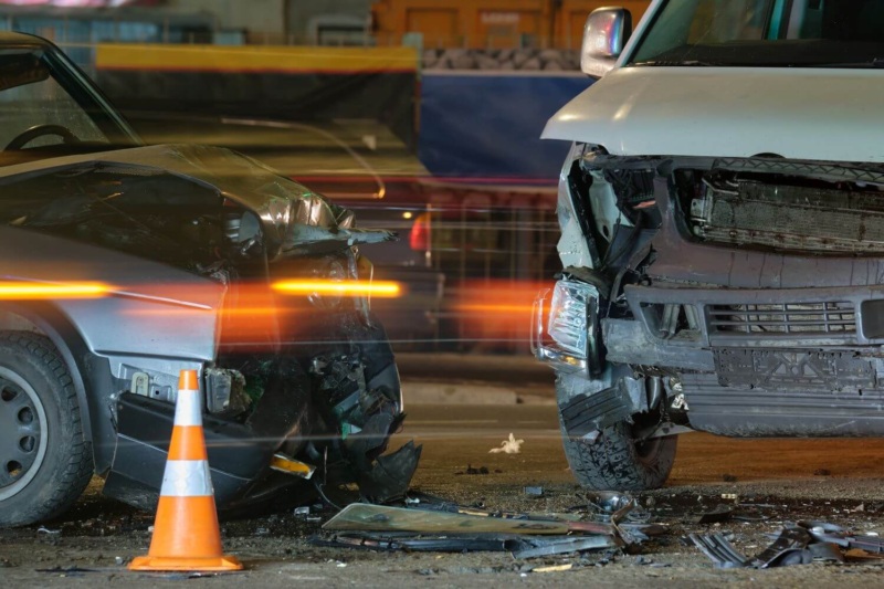 Nighttime T-bone accident involving pickup truck and sedan.