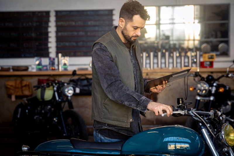 Insurance adjuster assesses damage after Michigan motorcycle accident.