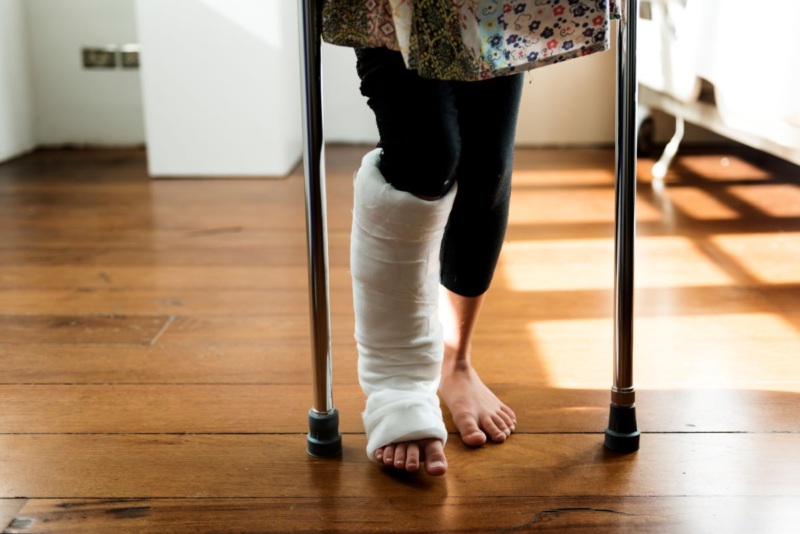 Michigan woman in leg cast walks on crutches after personal injury.