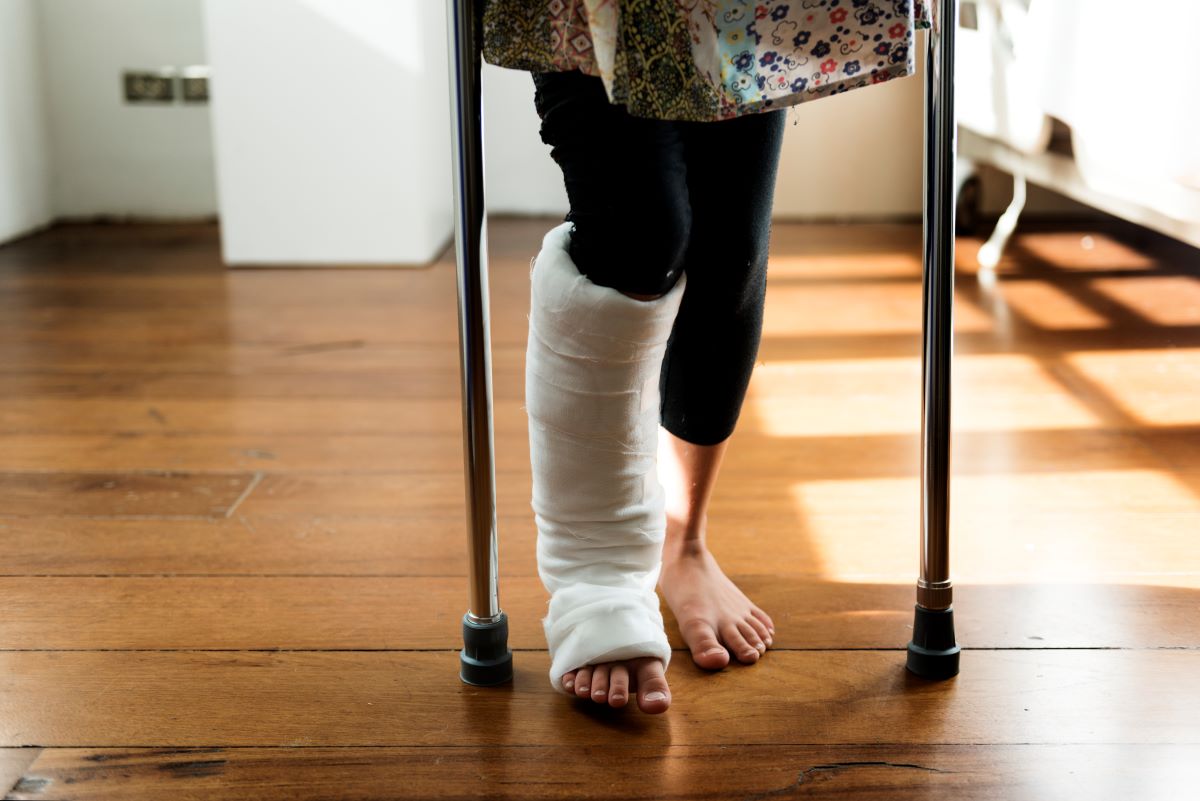 Michigan woman in leg cast walks on crutches after personal injury.